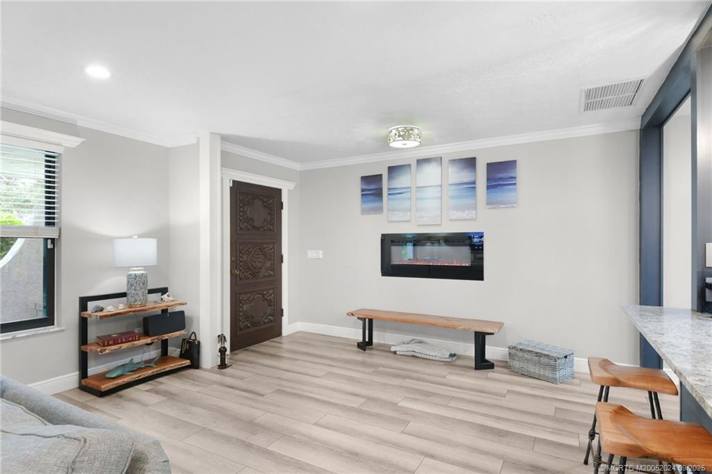 6 Copaire Road Sewall's Point, FL 34996 - Photo 25 of 76 a view of a livingroom with furniture and a workspace