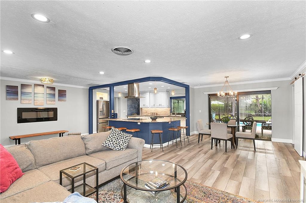 6 Copaire Road Sewall's Point, FL 34996 - Photo 29 of 76 a living room with furniture and a table