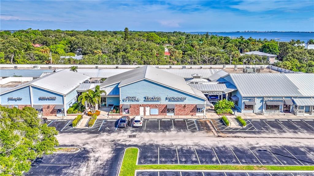 6 Copaire Road Sewall's Point, FL 34996 - Photo 3 of 76 an aerial view of a house with garden space and outdoor seating