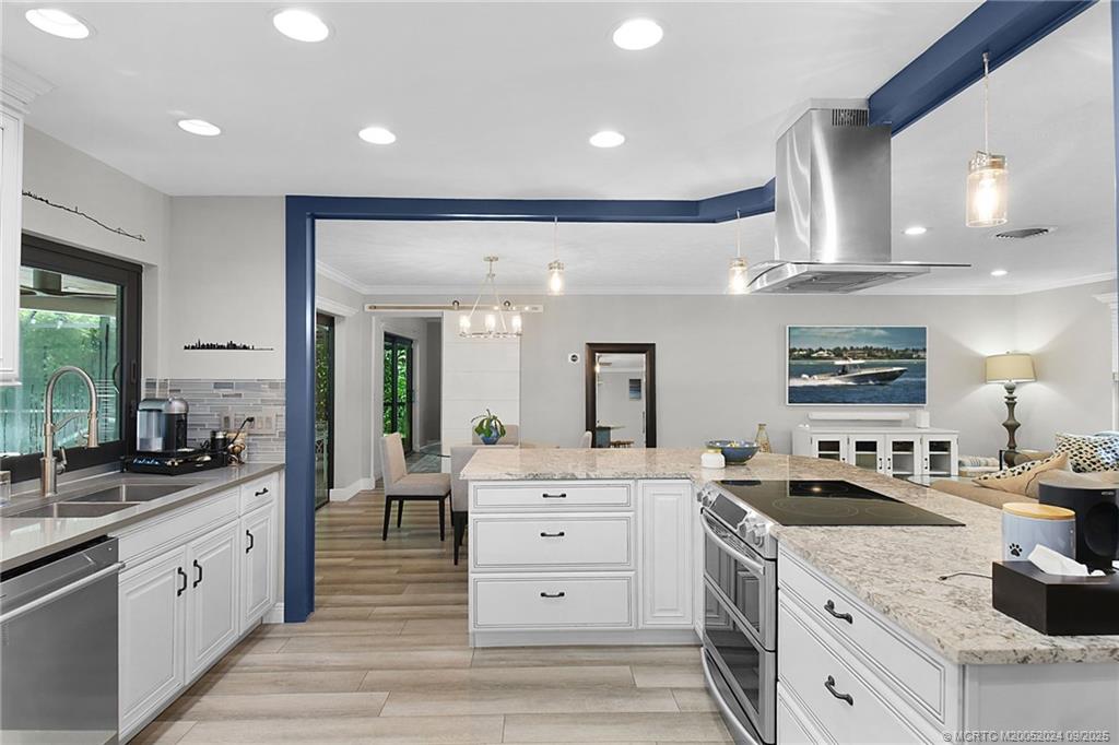 6 Copaire Road Sewall's Point, FL 34996 - Photo 37 of 76 a large white kitchen with stainless steel appliances