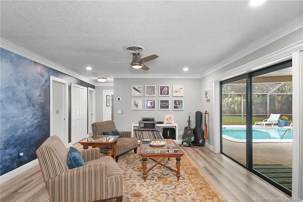 6 Copaire Road Sewall's Point, FL 34996 - Photo 39 of 76 a living room with furniture and a fireplace