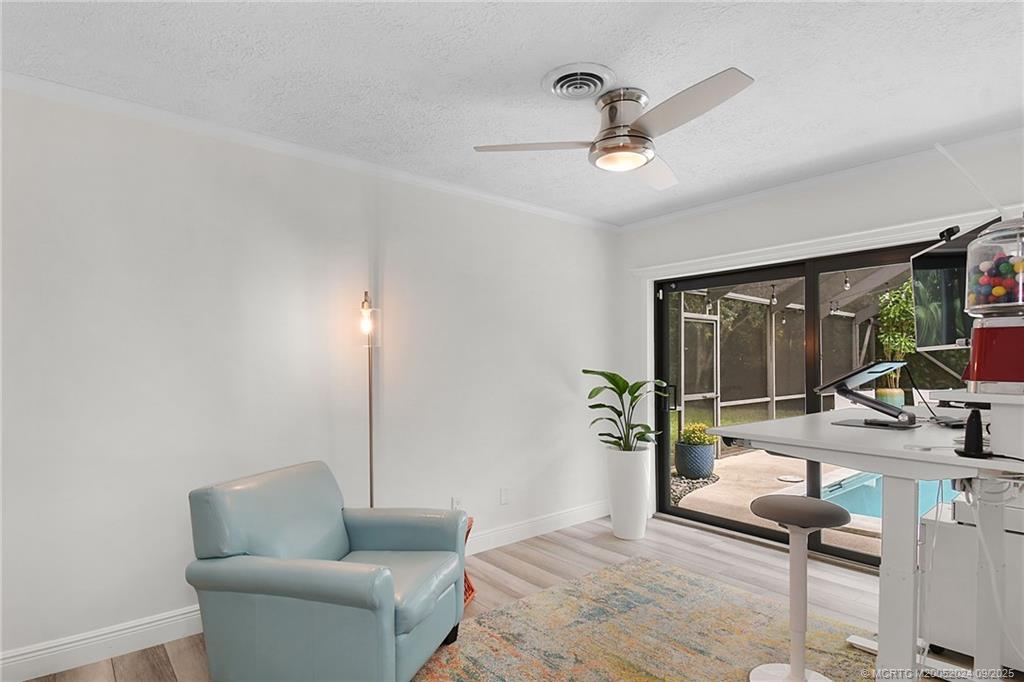 6 Copaire Road Sewall's Point, FL 34996 - Photo 46 of 76 a living room with furniture and a large window