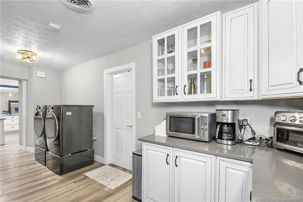 6 Copaire Road Sewall's Point, FL 34996 - Photo 52 of 76 a kitchen with stainless steel appliances granite countertop a refrigerator and a stove top oven