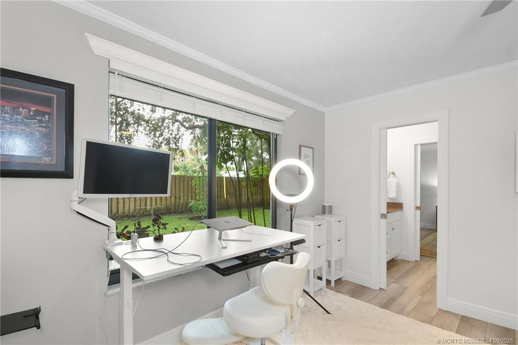 6 Copaire Road Sewall's Point, FL 34996 - Photo 54 of 76 a living room with a couch and a flat screen tv