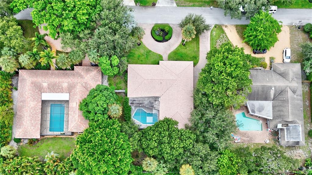 6 Copaire Road Sewall's Point, FL 34996 - Photo 73 of 76 an aerial view of a house with yard and outdoor seating