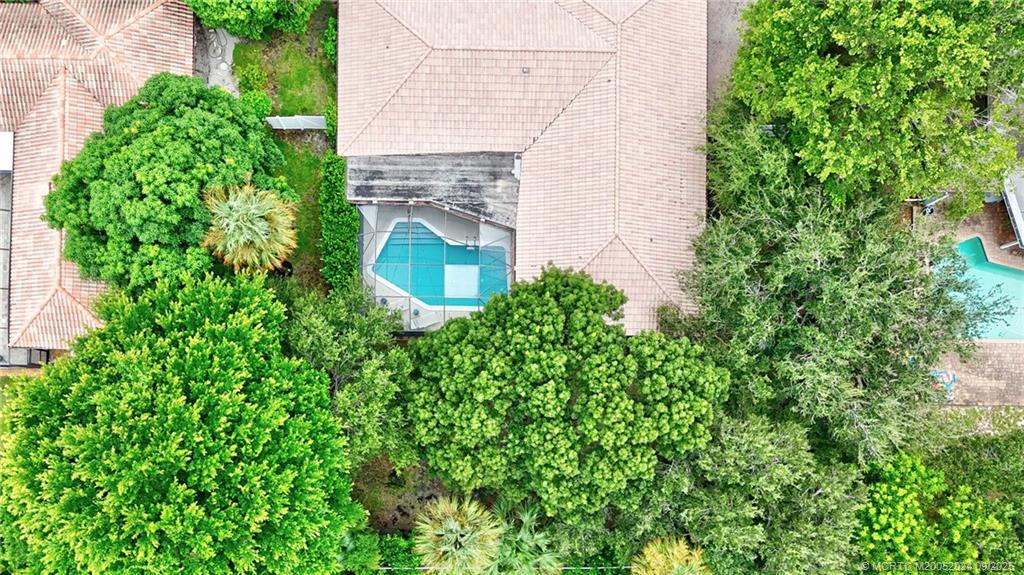 6 Copaire Road Sewall's Point, FL 34996 - Photo 74 of 76 a aerial view of a house with a yard and potted plants