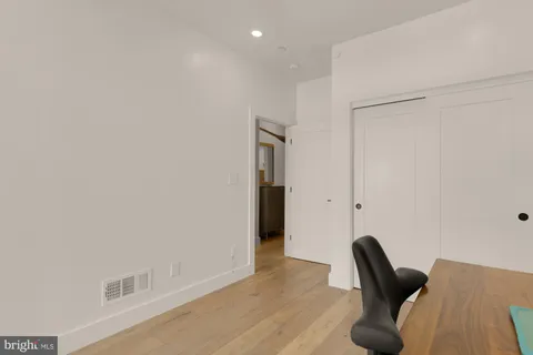 a view of a livingroom with furniture and wooden floor