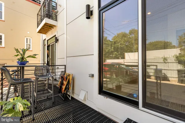 a view of a balcony with chairs