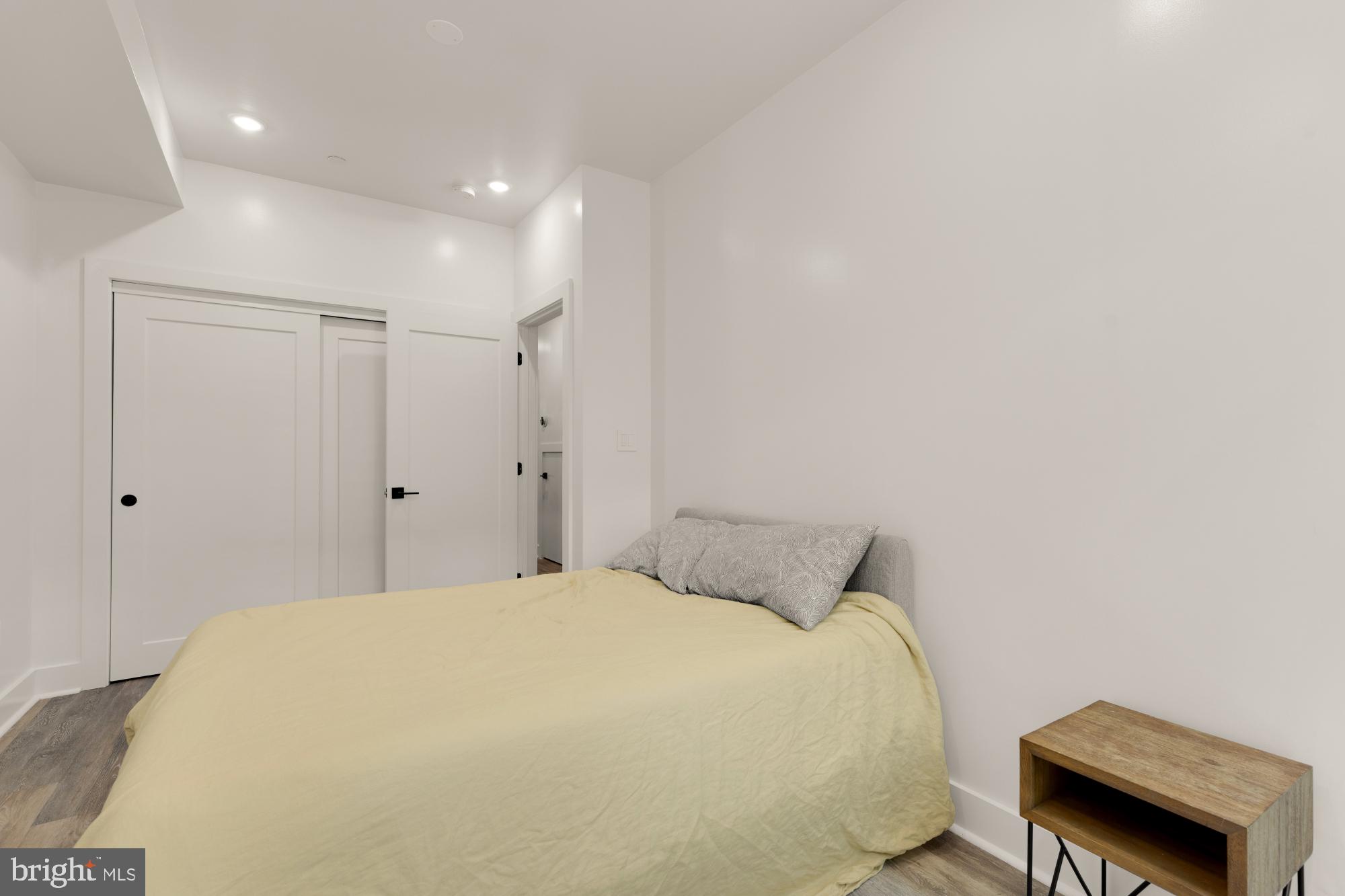 81 U Street Northwest, Unit A Washington, DC 20001 - Photo 33 of 46 a bedroom with a bed and a chair