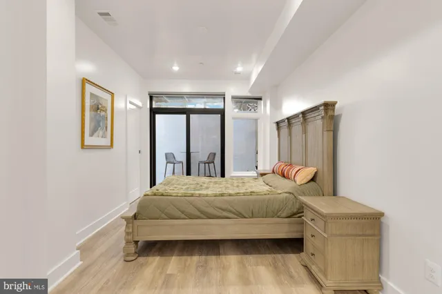 a bedroom with a bed and a dresser