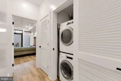 a view of a hallway with washer and dryer