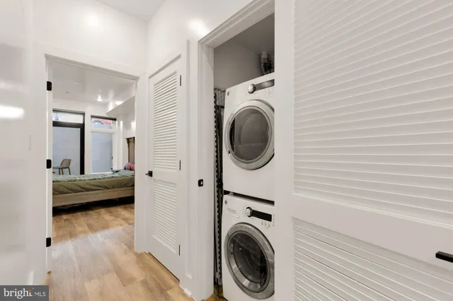 a view of a hallway with washer and dryer