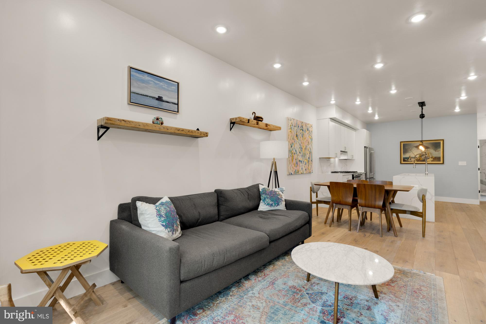 81 U Street Northwest, Unit A Washington, DC 20001 - Photo 4 of 46 a living room with furniture and a dining table with garden view