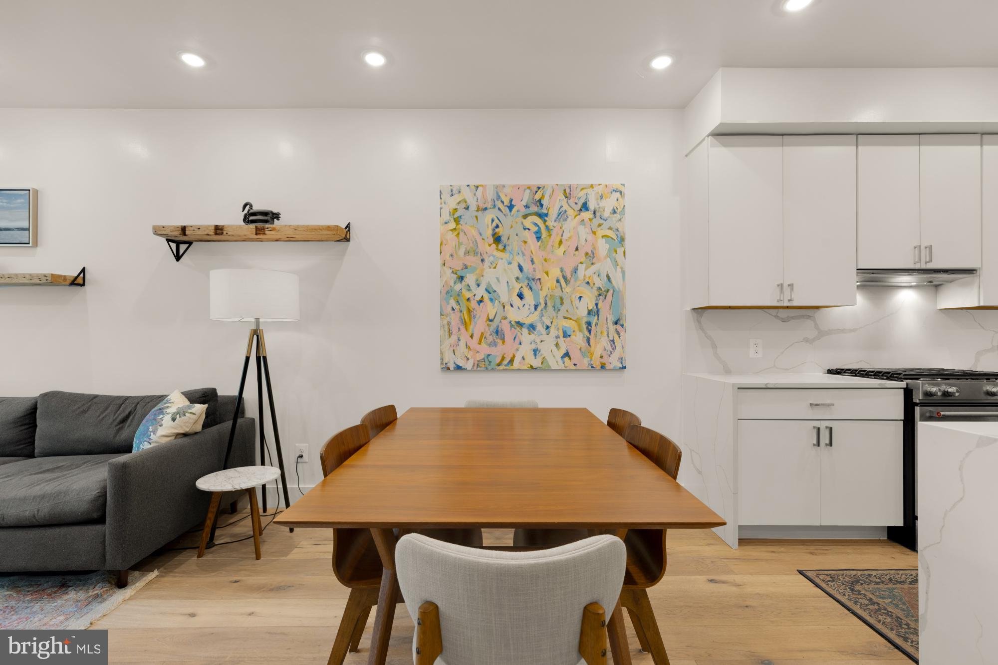 81 U Street Northwest, Unit A Washington, DC 20001 - Photo 10 of 46 a kitchen with stainless steel appliances granite countertop a sink a stove and a refrigerator