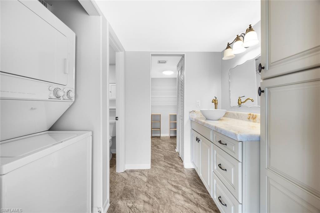 1083 Forest Lakes Drive, Unit 207 Naples, FL 34105 - Photo 17 of 21 a bathroom with a sink a toilet and shower