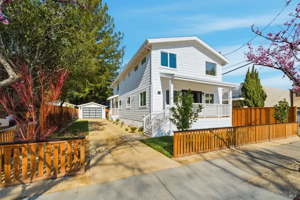a view of a house with a small yard
