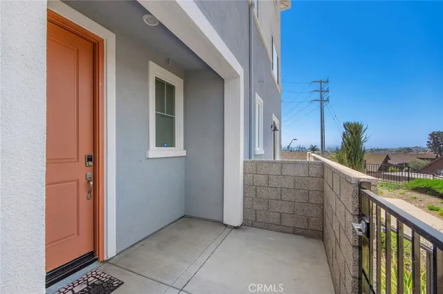 a view of a brick building next to a yard