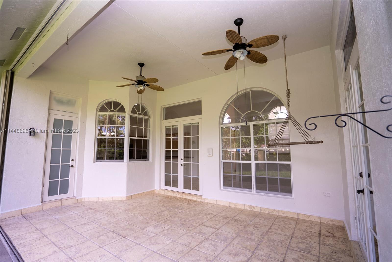 Kendall Miami, FL 33176 - Photo 28 of 28 a view of a big room with windows and chandelier fan