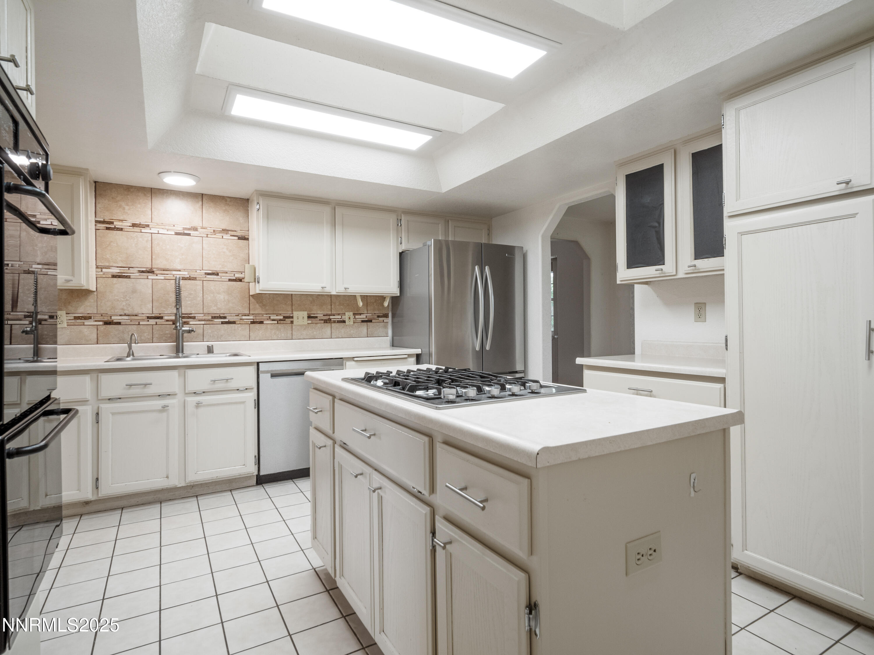 2843 Wade Street Minden, NV 89423 - Photo 18 of 74 a kitchen with a stove a sink and a refrigerator