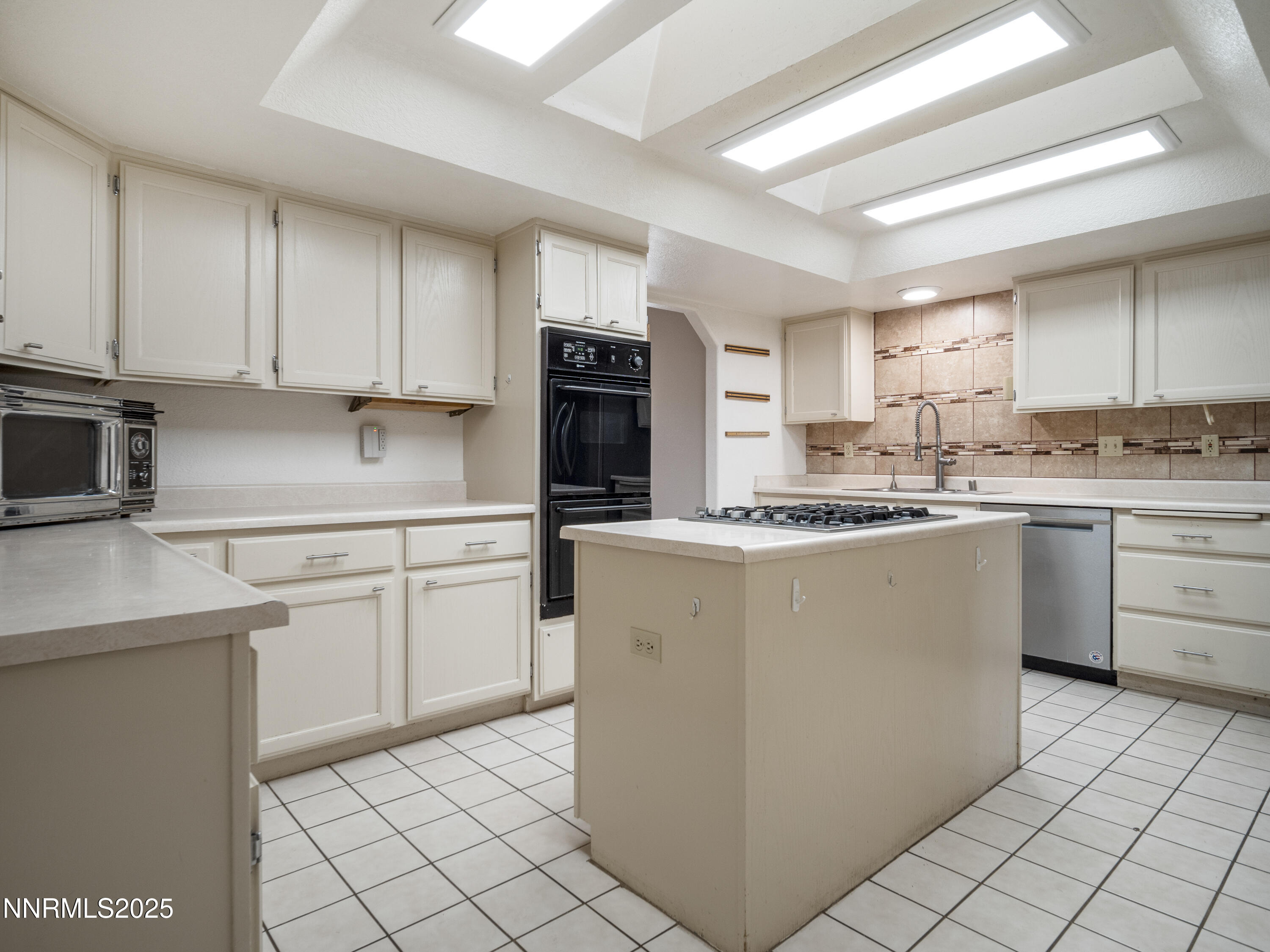 2843 Wade Street Minden, NV 89423 - Photo 19 of 74 a kitchen with a sink cabinets and window