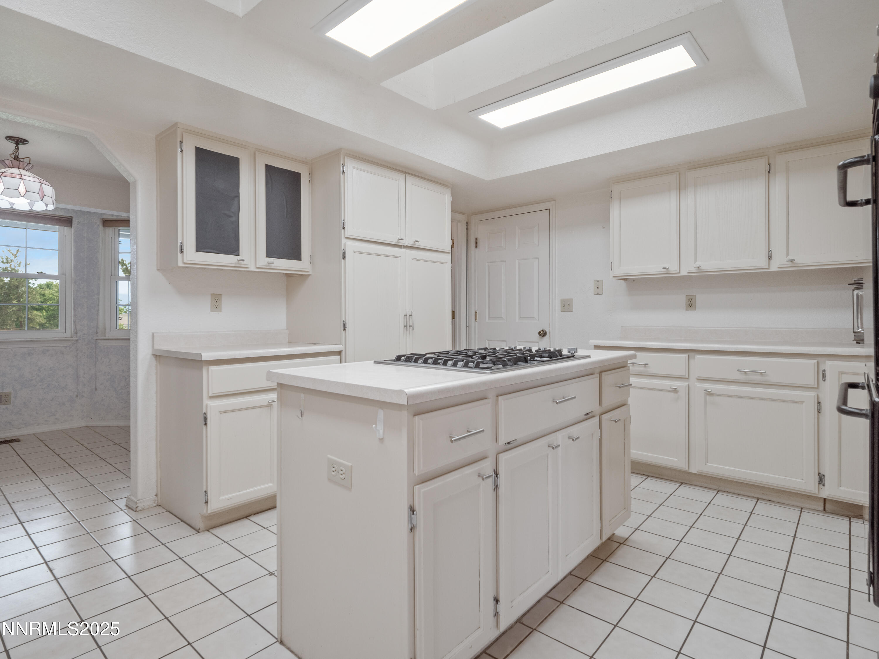 2843 Wade Street Minden, NV 89423 - Photo 21 of 74 a kitchen with white cabinets appliances and a sink