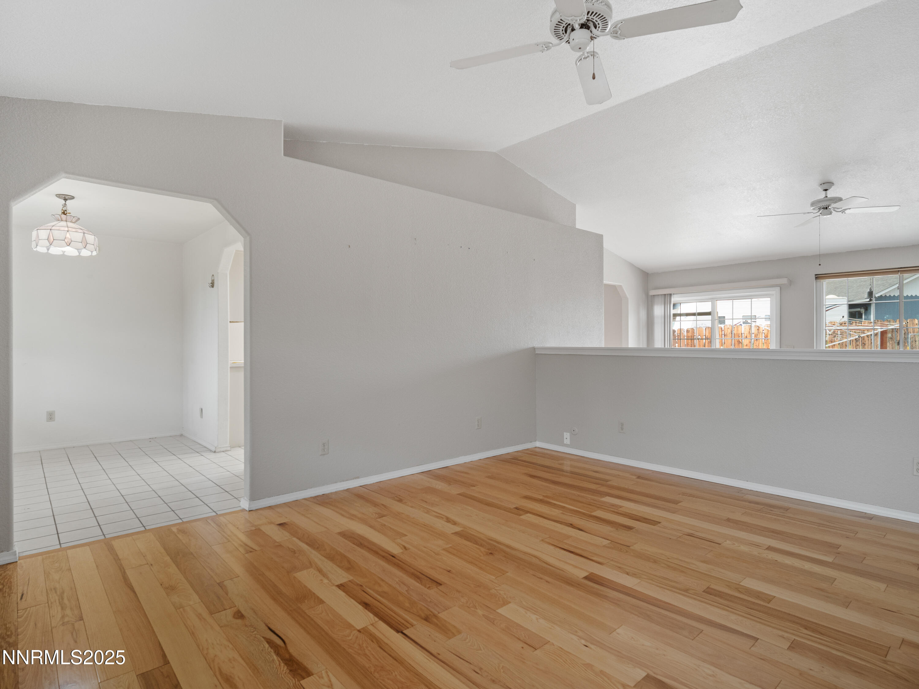 2843 Wade Street Minden, NV 89423 - Photo 26 of 74 an empty room with wooden floor and windows