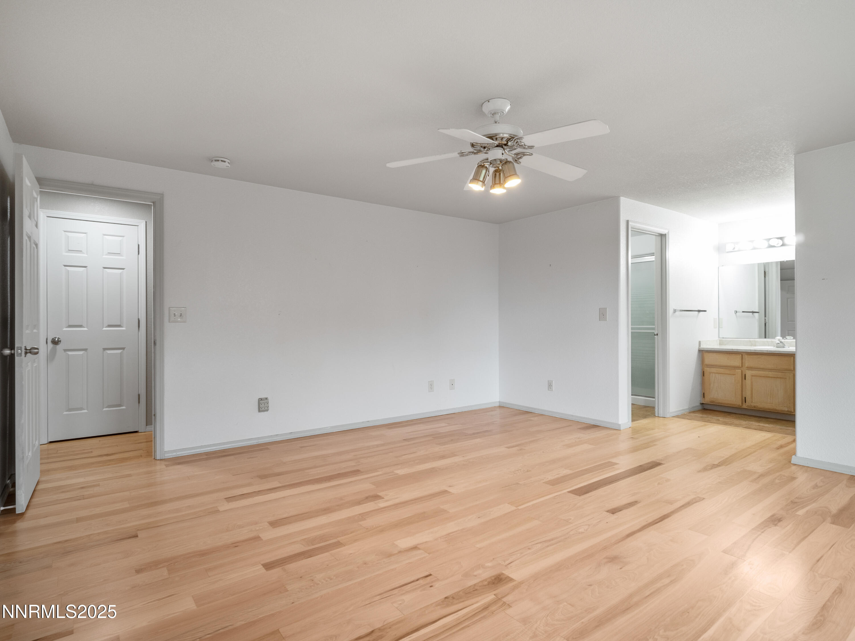 2843 Wade Street Minden, NV 89423 - Photo 36 of 74 a view of empty room with wooden floor and ceiling fan