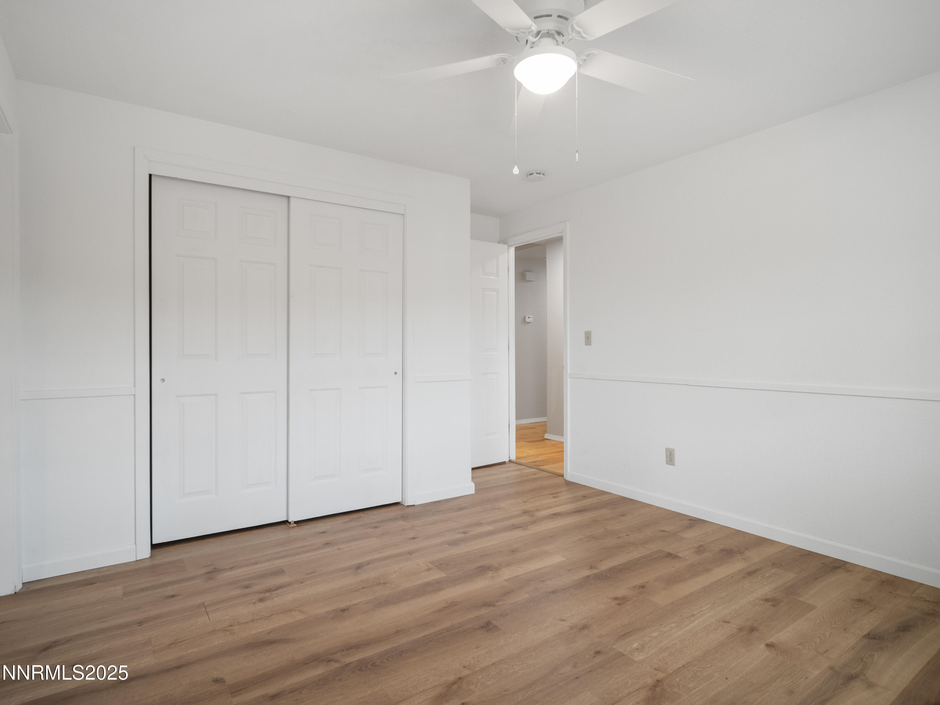 2843 Wade Street Minden, NV 89423 - Photo 51 of 74 a view of an empty room with wooden floor