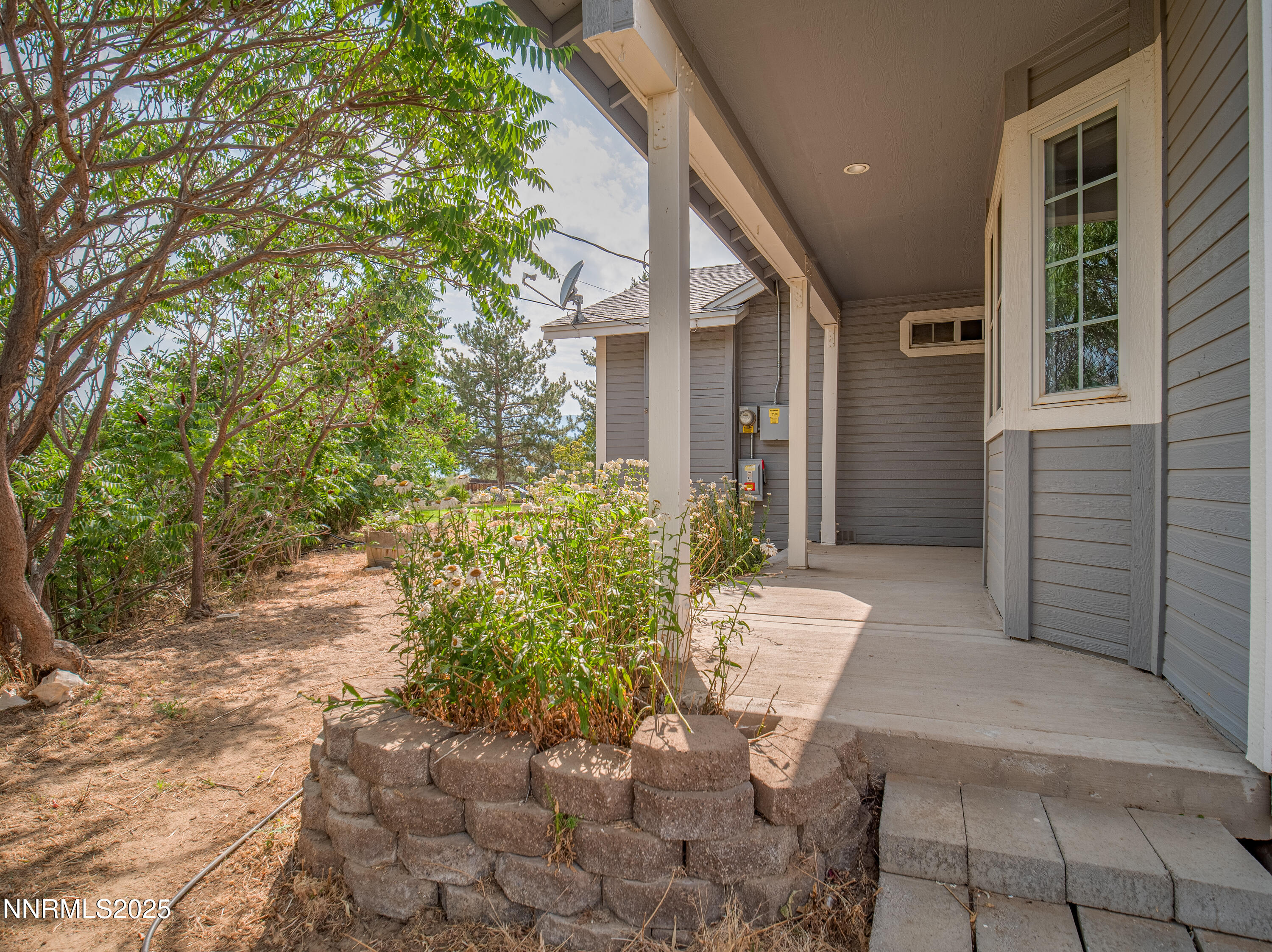 2843 Wade Street Minden, NV 89423 - Photo 68 of 74 a view of a patio with table and chairs and potted plants