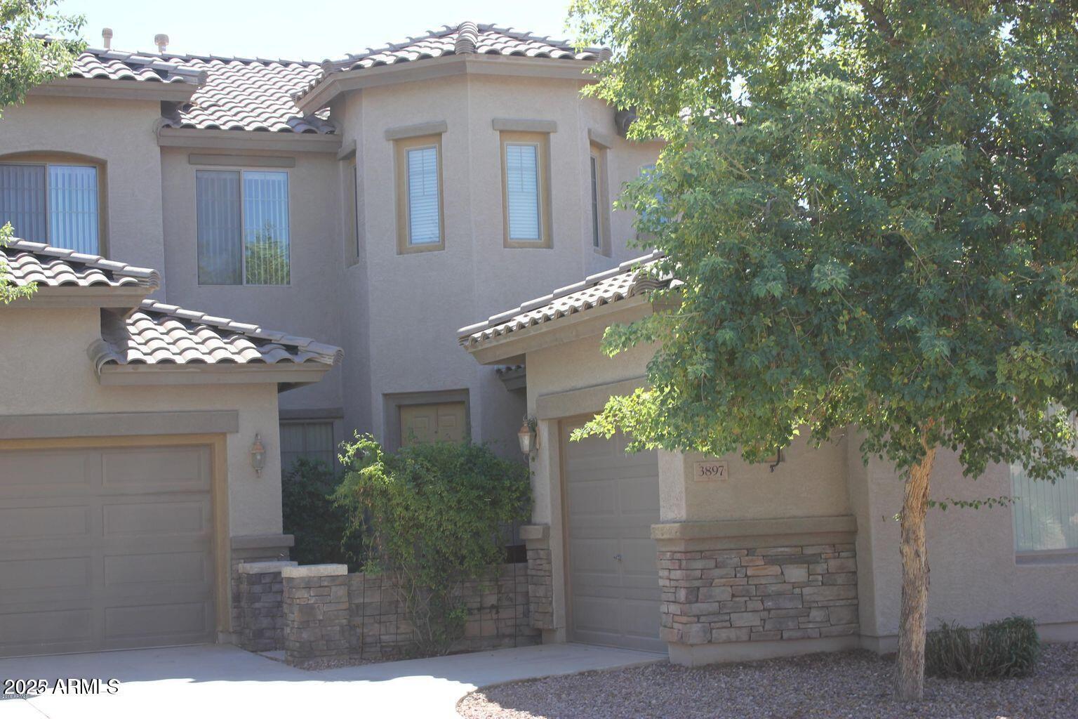3897 East Powell Way Gilbert, AZ 85298 - Photo 1 of 9 a front view of a house with plants