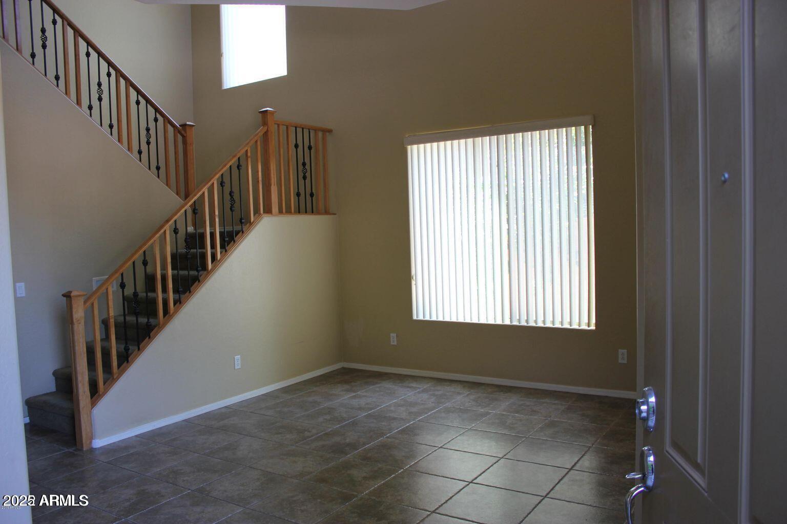 3897 East Powell Way Gilbert, AZ 85298 - Photo 3 of 9 a view of an entryway with wooden floor