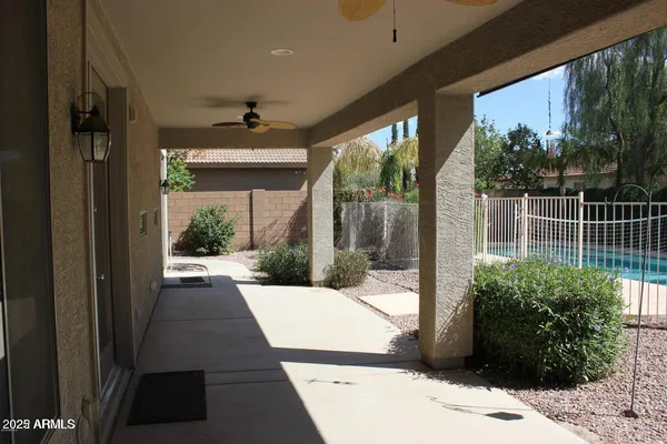 a view of potted plants in front of a building