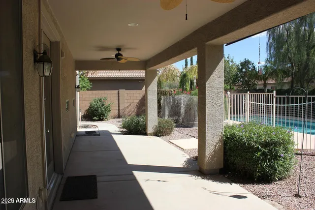 a view of potted plants in front of a building