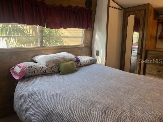 3000 Clarcona Road, Unit 438 Apopka, FL 32703 - Photo 4 of 7 a bedroom with a bed and a window