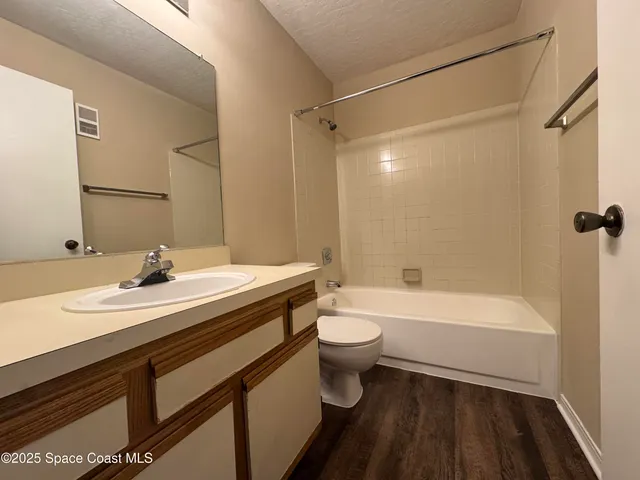 a bathroom with a sink a toilet and a bathtub