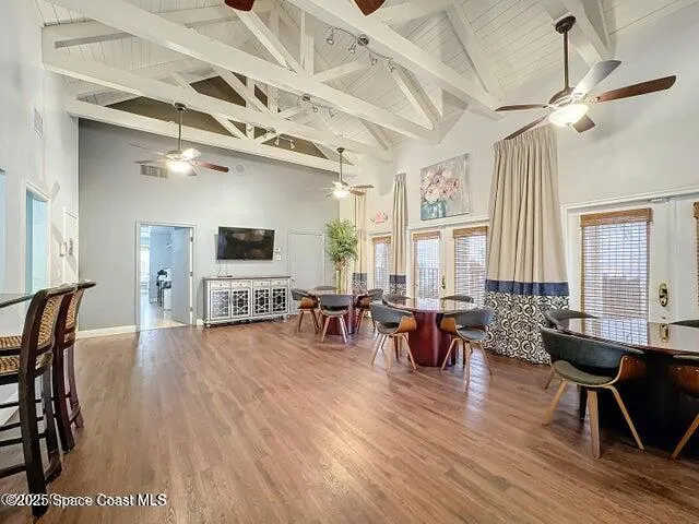 a view of a kitchen with a sink and wooden floor