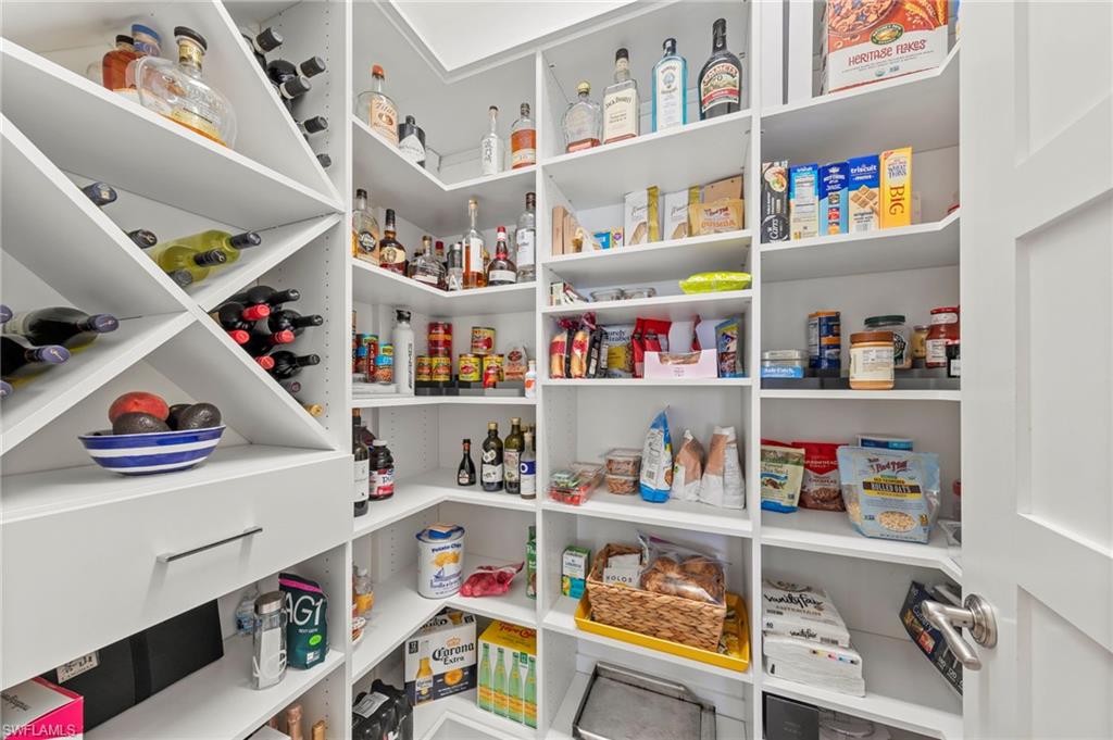 14785 Dockside Lane Naples, FL 34114 - Photo 12 of 50 Custom California Closet organizers in the walk-in pantry.