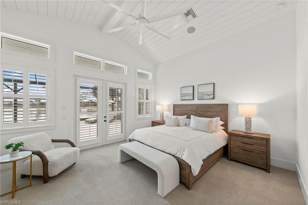 14785 Dockside Lane Naples, FL 34114 - Photo 14 of 50 Bedroom with access to exterior, carpet, ceiling fan, a high wooden beamed ceiling, and french doors New CEILING FAN (November 2018)