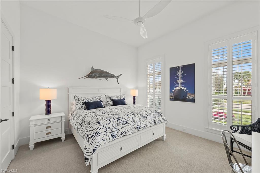 14785 Dockside Lane Naples, FL 34114 - Photo 19 of 50 Bedroom featuring light carpet, ceiling fan, and lofted ceiling New CEILING FAN (November 2018)