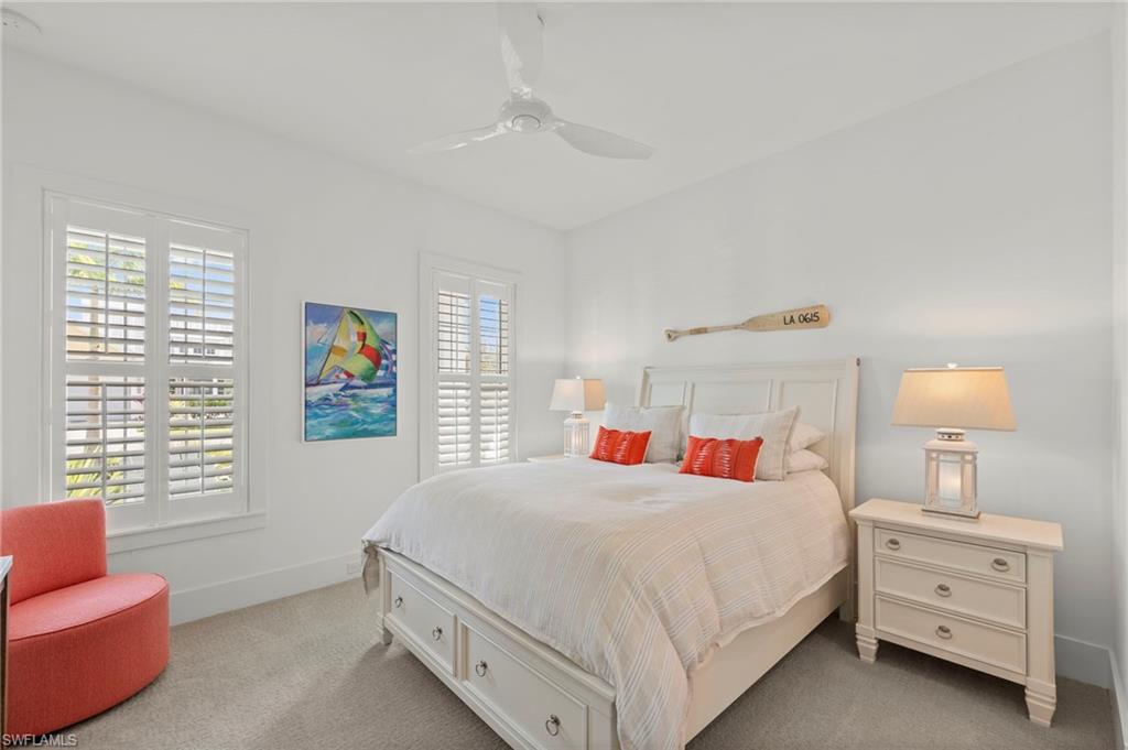14785 Dockside Lane Naples, FL 34114 - Photo 21 of 50 Bedroom featuring ceiling fan, multiple windows, and carpet flooring New CEILING FAN (November 2018)