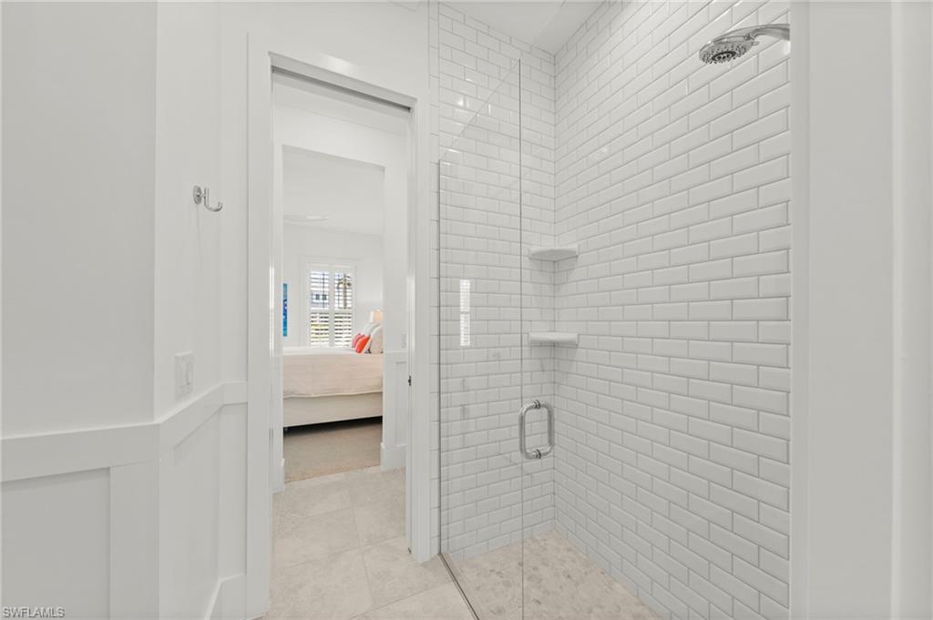 14785 Dockside Lane Naples, FL 34114 - Photo 23 of 50 Ensuite bathroom with a shower stall
