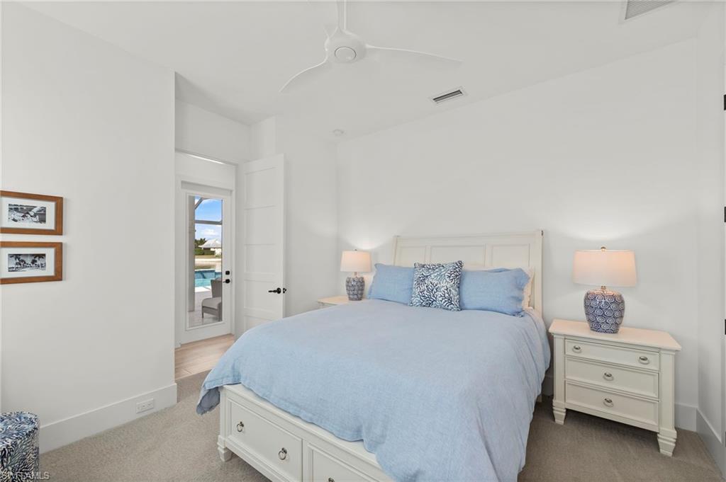 14785 Dockside Lane Naples, FL 34114 - Photo 24 of 50 Carpeted bedroom with baseboards and ceiling fan New CEILING FAN (November 2018)