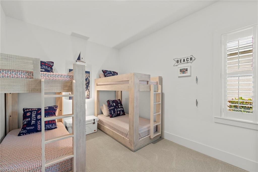 14785 Dockside Lane Naples, FL 34114 - Photo 25 of 50 Current bunk room can be converted back to a THIRD GARAGE BAY. Bedroom with baseboards and carpet floors New LIGHT FIXTURE (November 2018),