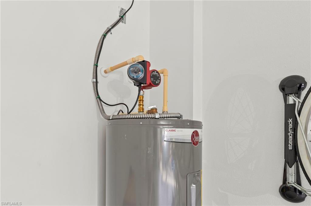 14785 Dockside Lane Naples, FL 34114 - Photo 31 of 50 Utilities with electric water heater New HOT WATER RECIRCULATION PUMP (October 2022), New GARAGE INTERIOR PAINT (July 2023)