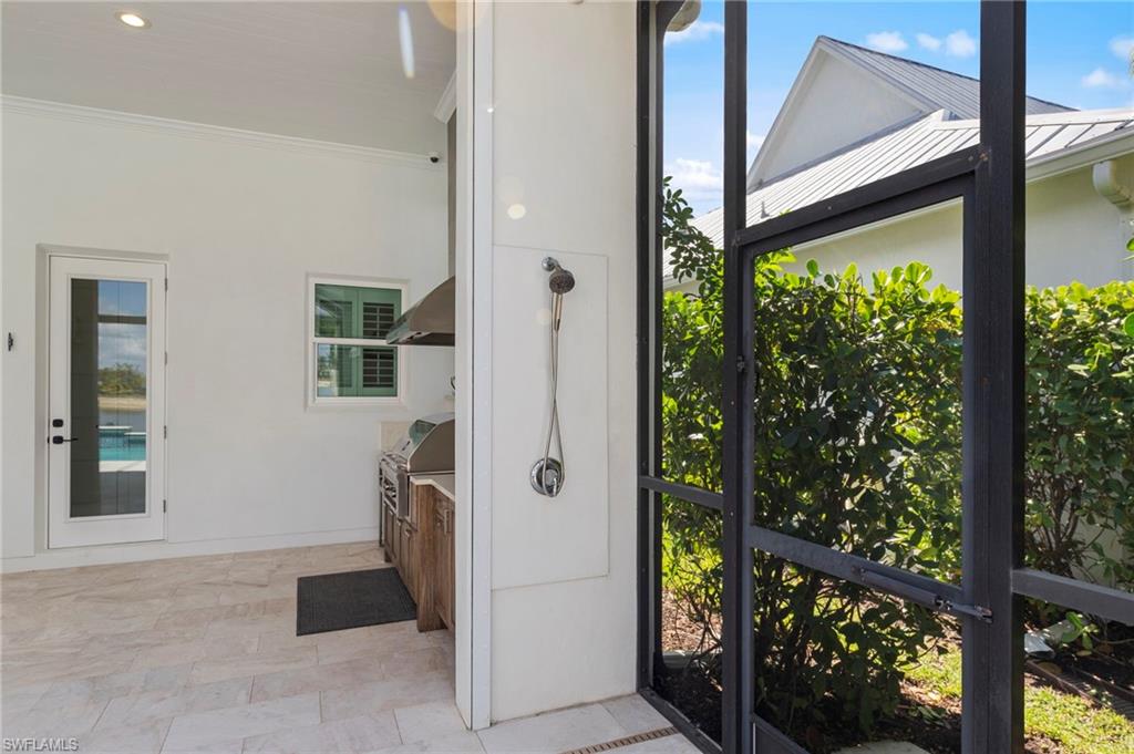 14785 Dockside Lane Naples, FL 34114 - Photo 37 of 50 Unfurnished sunroom featuring healthy amount of natural light