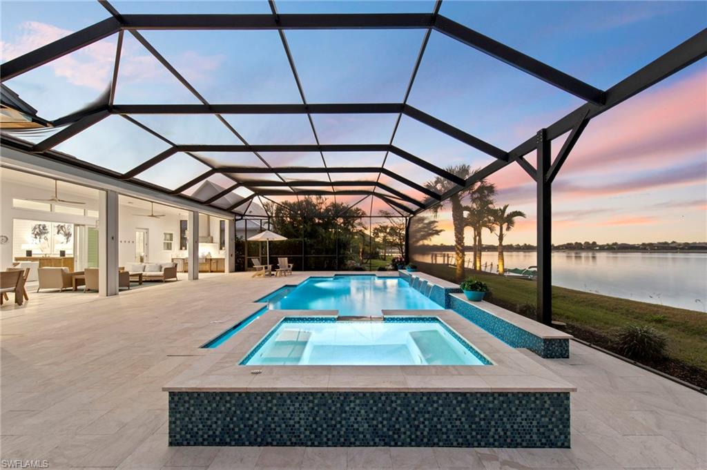 14785 Dockside Lane Naples, FL 34114 - Photo 41 of 50 Pool at dusk with a water view, an outdoor living space, a lanai, a patio, and a sunroom New LANDSCAPE LIGHTING (February 2019)
