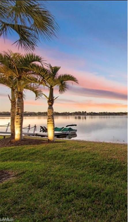 14785 Dockside Lane Naples, FL 34114 - Photo 42 of 50 Water view with a boat dock, sunset sky and long lake views.