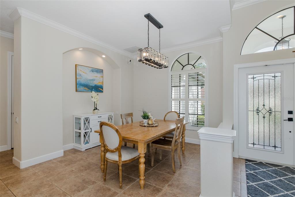 1429 El Pardo Drive Trinity, FL 34655 - Photo 20 of 100 a view of a dining room with furniture and wooden floor
