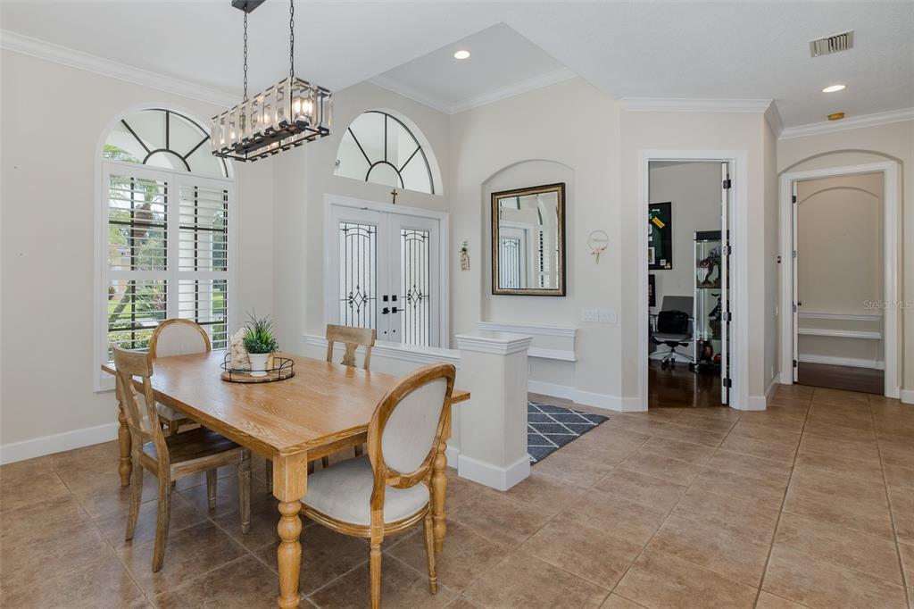 1429 El Pardo Drive Trinity, FL 34655 - Photo 21 of 100 a view of a dining room with furniture and chandelier