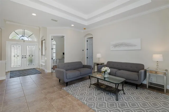 a bathroom with a granite countertop sink a toilet a mirror a vanity a bathtub and shower